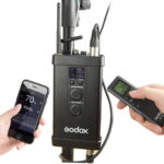 Kit d'éclairage LED flexible Godox FL100 avec télécommande et contrôle via smartphone, affichant des réglages de luminosité et de température de couleur.